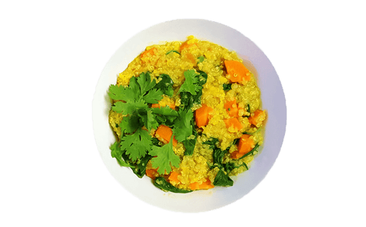 Yellow quinoa and vegetables in a bowl