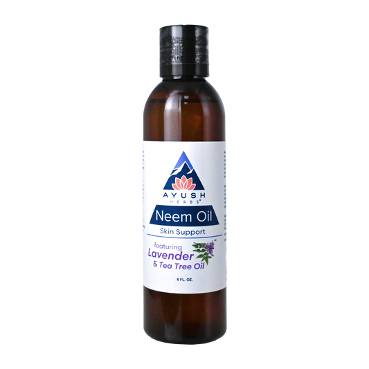 Bottle of Ayush Neem Oil with a white label on a white background